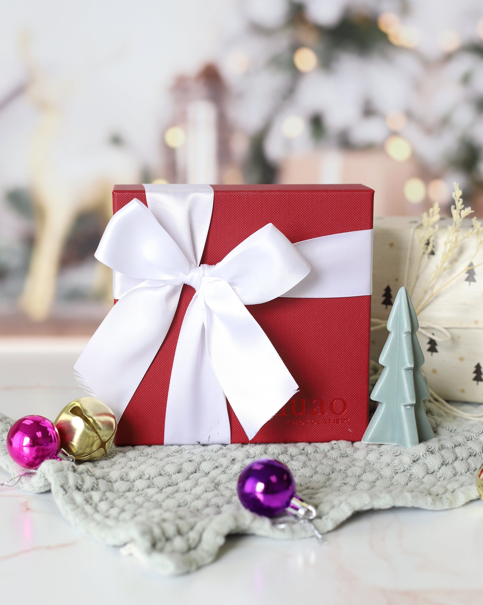 more joy gift box with holiday decorations