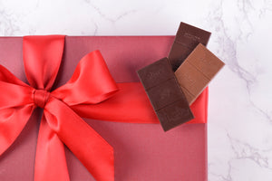 red gift box with unpackaged mini chocolate bars