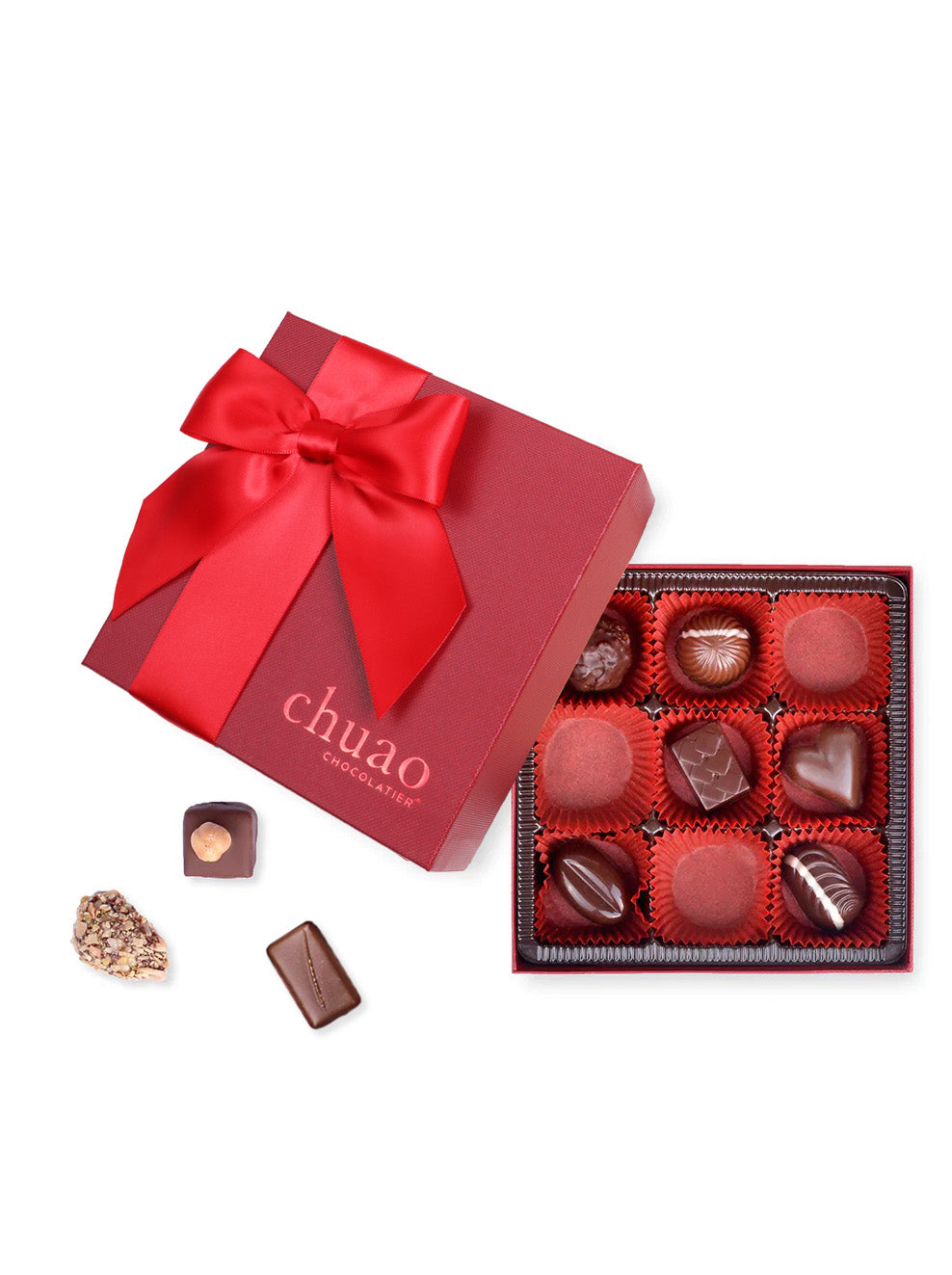 9 bonbons and truffles in a red square gift box tied with a red bow
