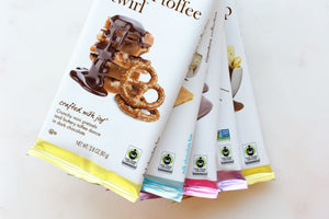 5 chuao chocolate bars fanned on top of each other showing the fair trade seal