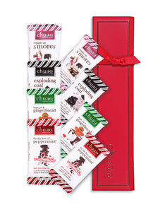 4 pairs of holiday flavors from chuao stacked on top of each other next to a red rectangular gift set box with a bow