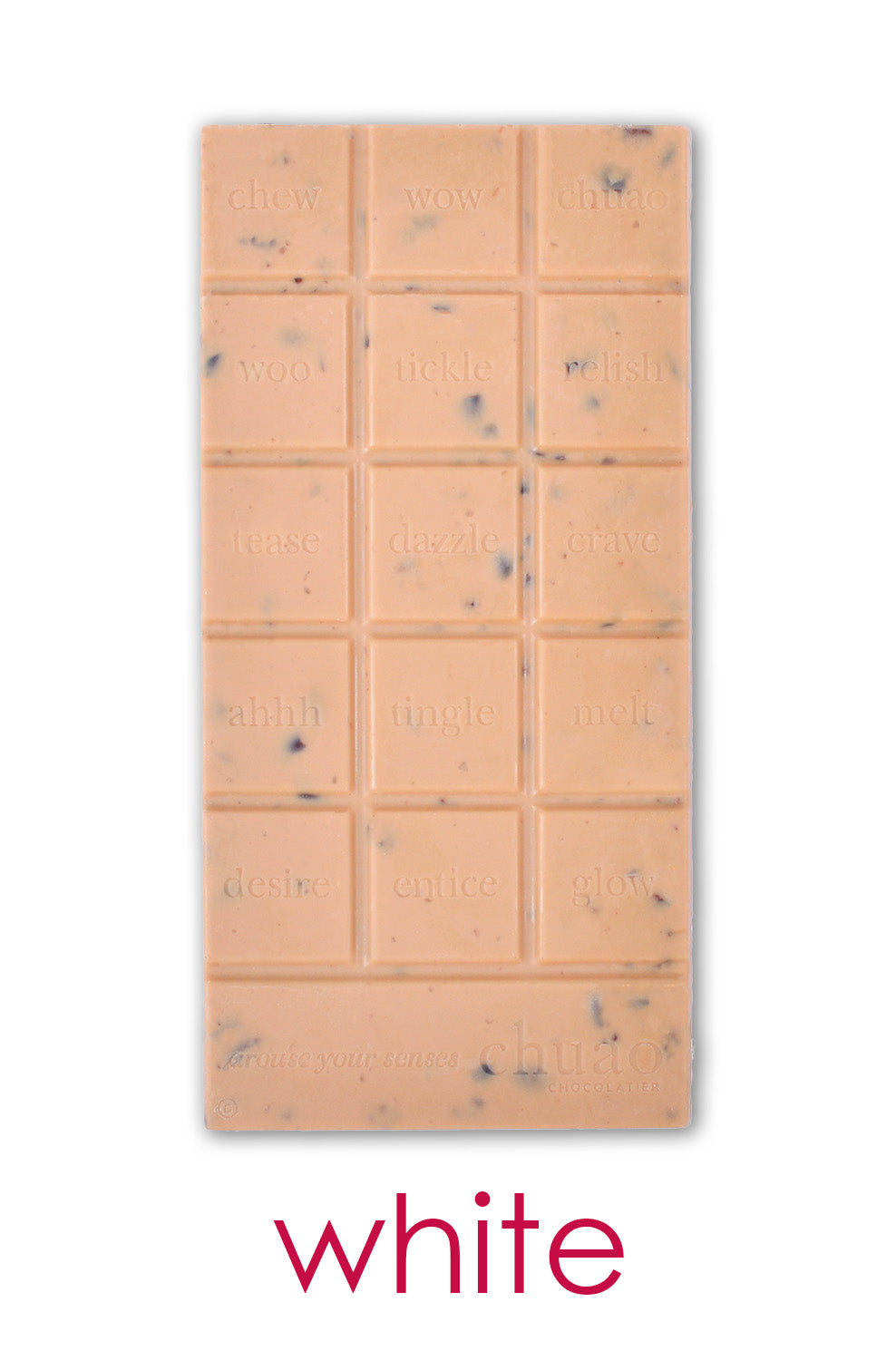 an unwrapped bar of chuao's white chocolate with cacao nibs.