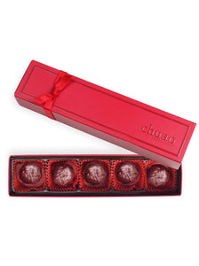 5 pieces of chocolate firecracker truffles in a  red gift box
